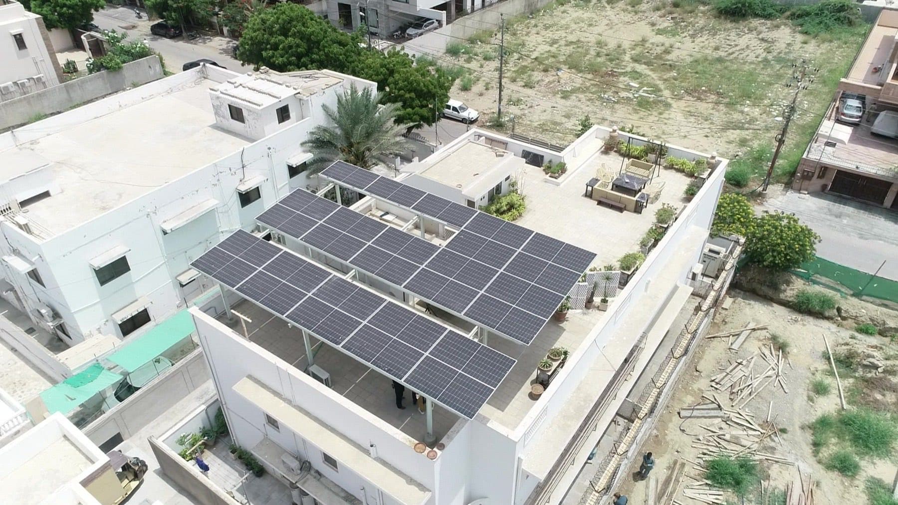 Aerial view of a residential rooftop solar system on a two-storey home